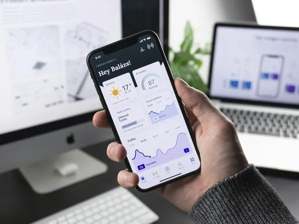 Mobile app dashboard preview in a modern workspace
