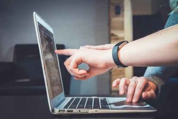 Coding laptop in a clean web development workspace